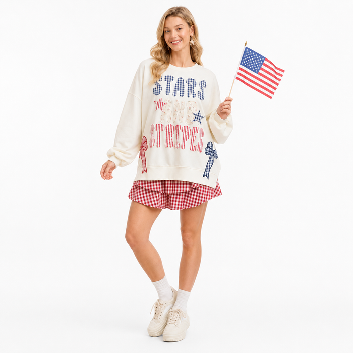 Women patriotic sweater with pocketed design, long sleeves, slight stretch fabric and festive red white blue accents for July