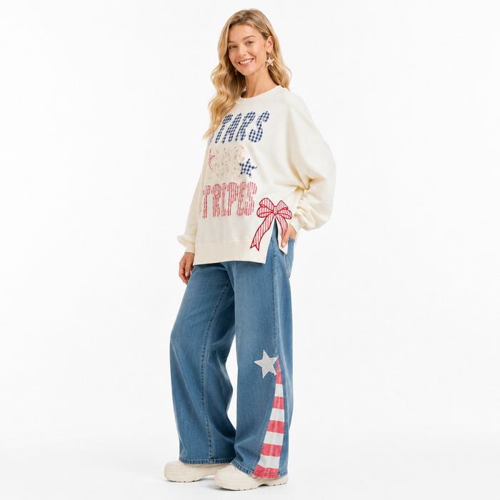 Soft stars and stripes pullover for women with ribbed hem, pocketed feature and festive patchwork design for casual wear now!
