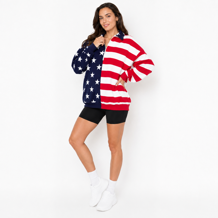 Women's sweatshirt shown with half zip neck, long sleeves, star panel and stripe design for casual everyday patriotic outfit.