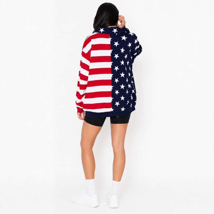 Half zip women's sweatshirt shown with American flag star and stripe detail, long sleeves and casual everyday outfit styling.