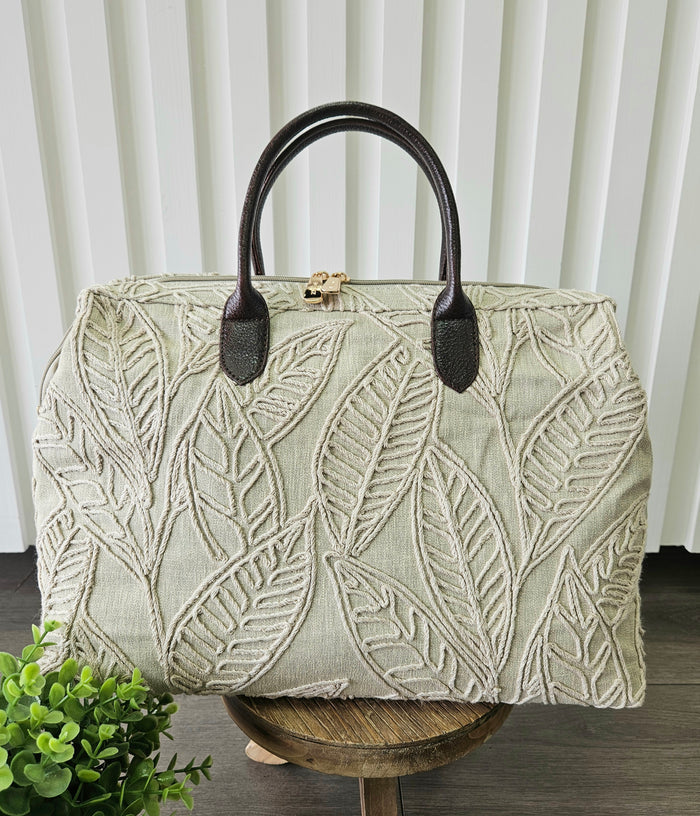 Carpet bag with leaf design.
