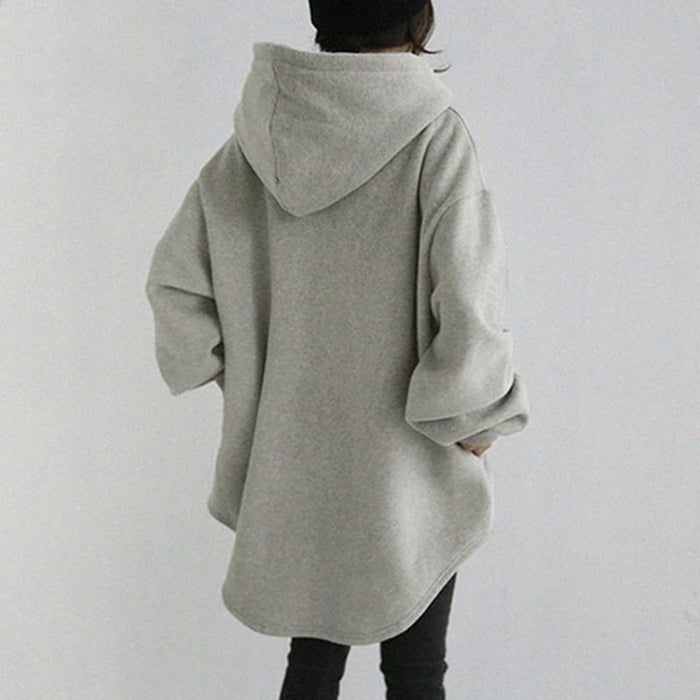 Women's longline hoodie shown in side profile with extended hem, relaxed shape and hood profile for outfit styling reference.