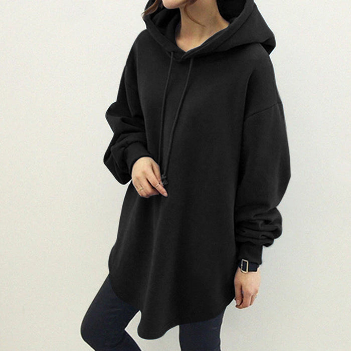 Women's hooded sweatshirt styled for casual streetwear, showing longline shape and relaxed proportions from the front studio.