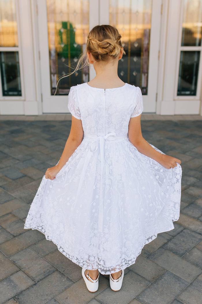 girl in white lace dress
