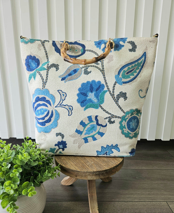 Floral print bag with handles.