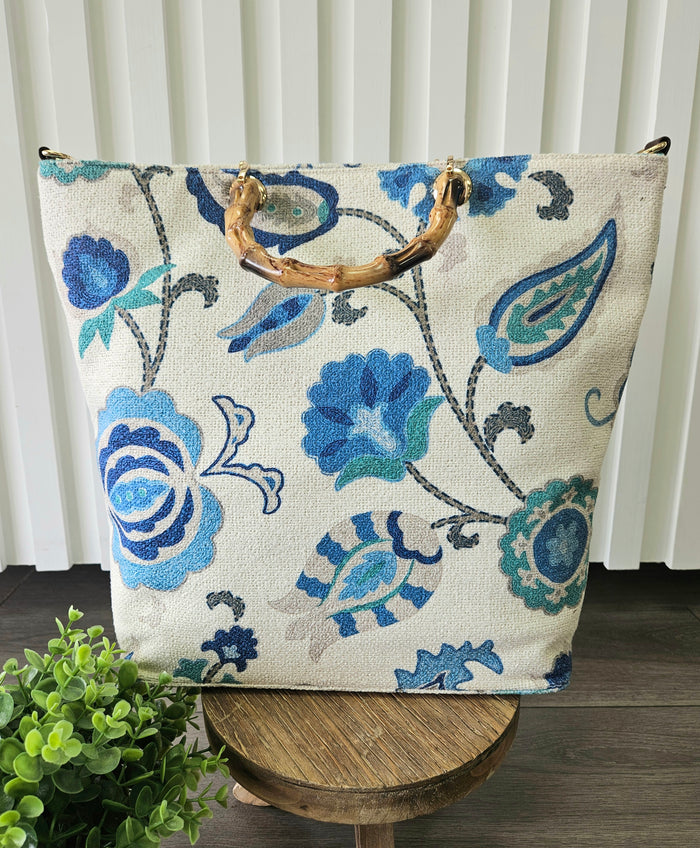 Floral print bag with handles.