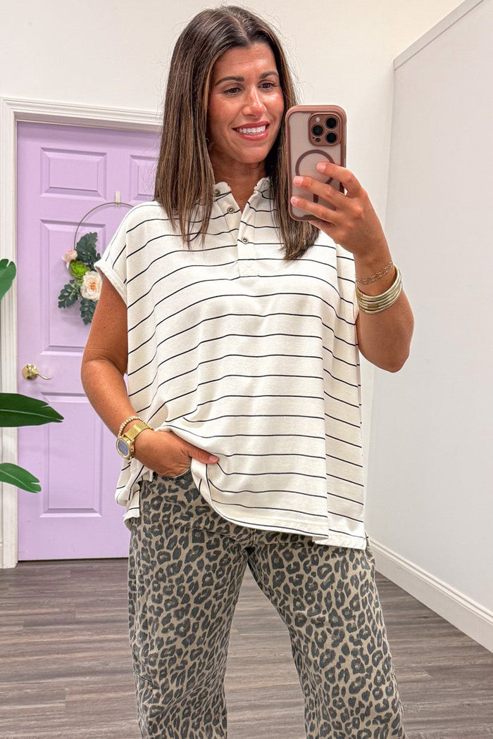 mineral washed ivory and black striped cap sleeve collared neckline polo style top