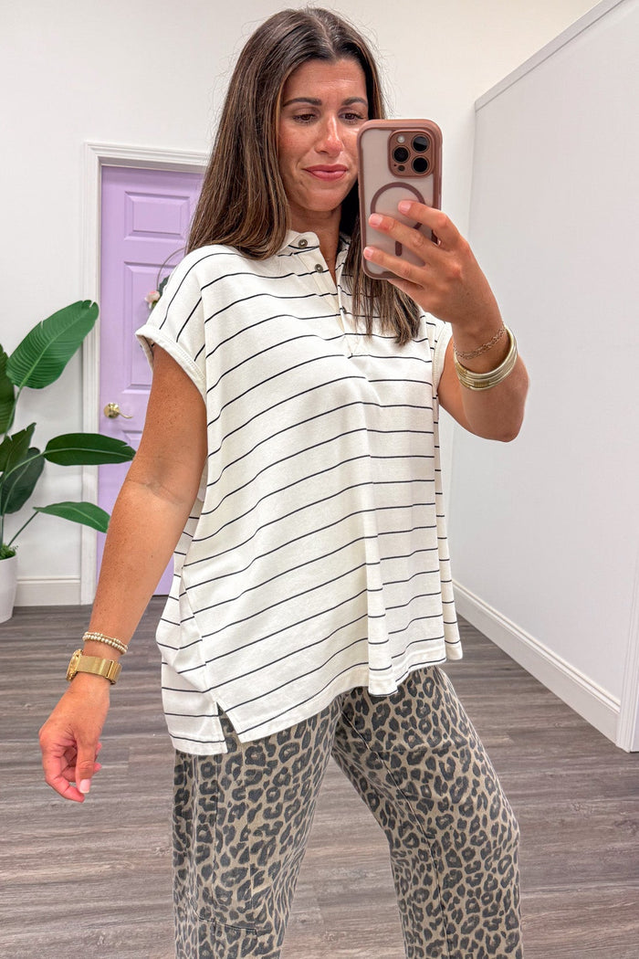 mineral washed ivory and black striped cap sleeve button front bodice polo style top