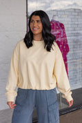 Women's butter pale yellow terry knit long sleeve pullover top with bubble hem by Wishlist