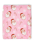 Pink blanket with Santa Claus and candy cane pattern