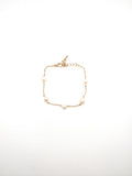 Scattered pearls on gold chain bracelet adjustable