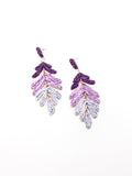 A pair of purple ombre cascading leaf earrings with gold accents on a white background.