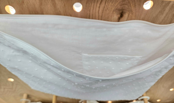 Open cotton zipper top envelope with pocket inside.