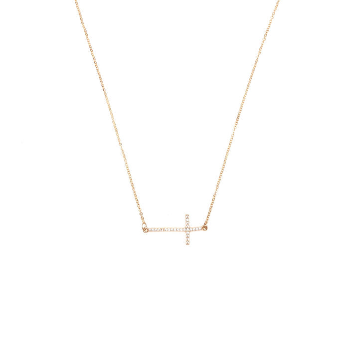 Gold sideways cross necklace.
