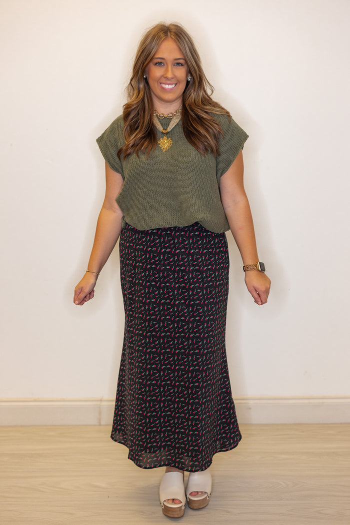 Women's olive green short sleeve sweater knit top by Wishlist shown styled with a skirt