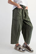 Person wearing green cargo pants and sneakers