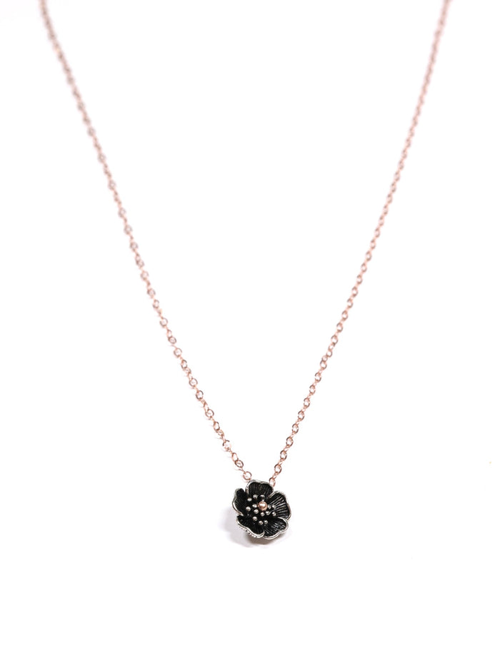 Close-up of a rose gold necklace with a five-petal flower pendant and dual-link chain – Five Fold Bloom Necklace in rose gold