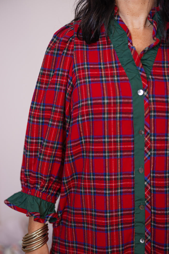 Women's red and green plaid flannel button front dress with ruffle details by Entro showing flannel print