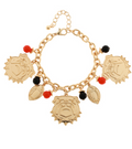 Gold charm bracelet with bulldog and red and black beads charms