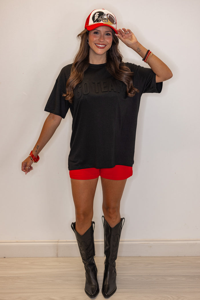 Women's black lightweight top with embossed 'Go Team' in center by Jess Lea showing full front view