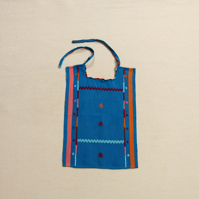 Handwoven cotton bib with embroidered borders and frog motifs, Oaxaca Mexico
