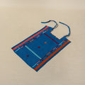 Handwoven cotton bib with embroidered borders and frog motifs, Oaxaca Mexico
