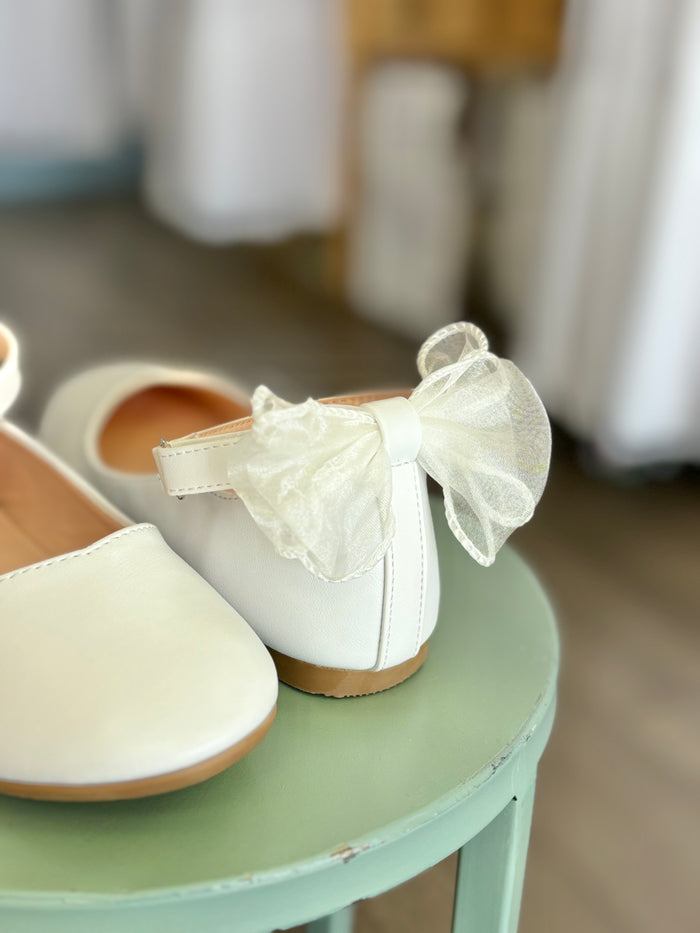 girl's flats with strap and bow in back