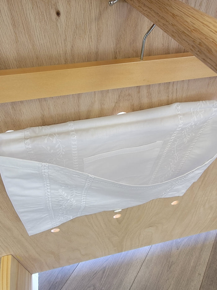 Open white envelope with pocket inside.