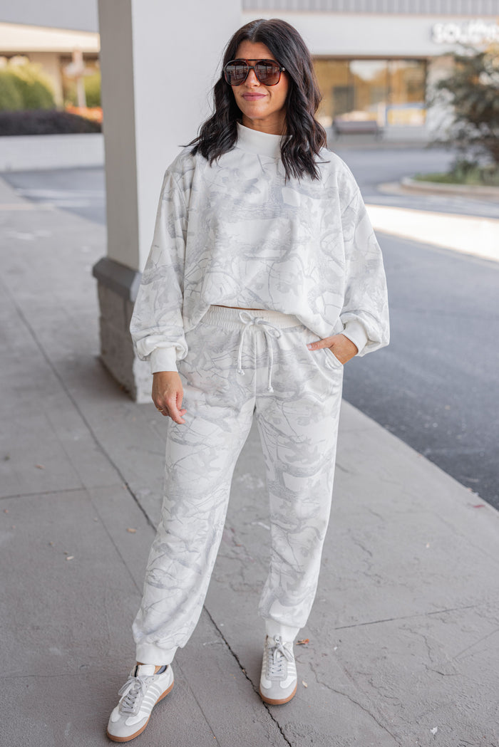 Women's grey snow camo joggers by BucketList showing full front view