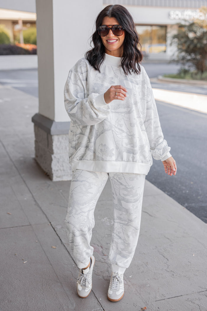 Women's grey snow camo oversized sweatshirt by BucketList, perfect for cooler weather