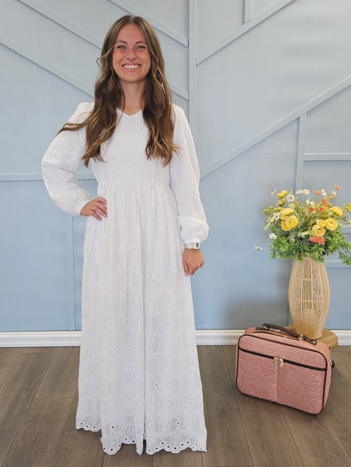 White eyelet dress with V-neck.