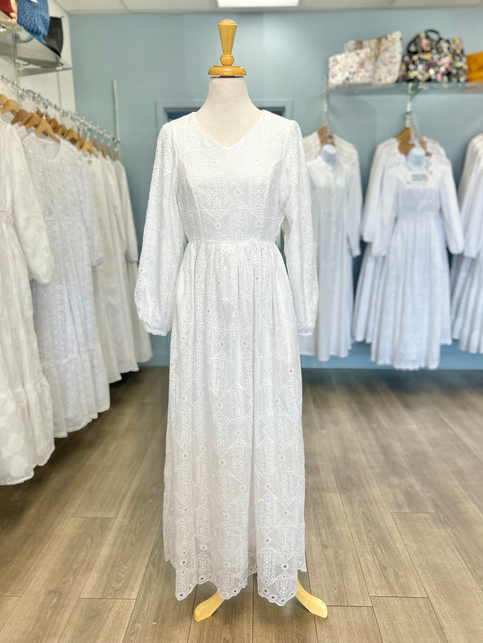 White eyelet dress with V-neck.