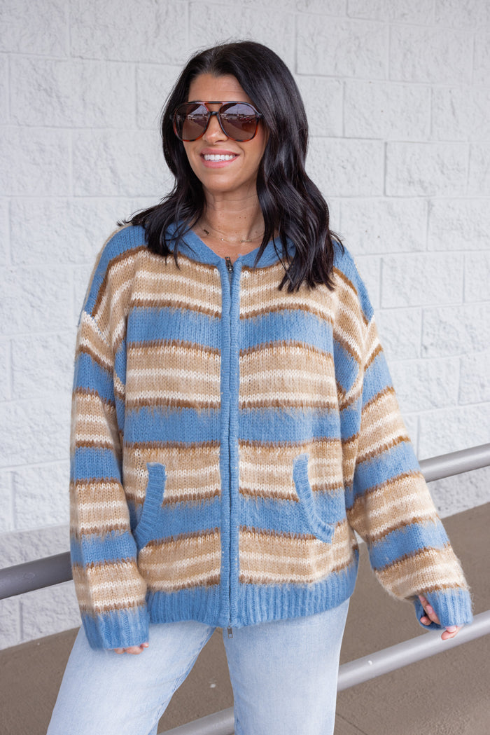 Women's blue and tan striped sweater knit jacket with a zipper front and hood by Mustard Seed