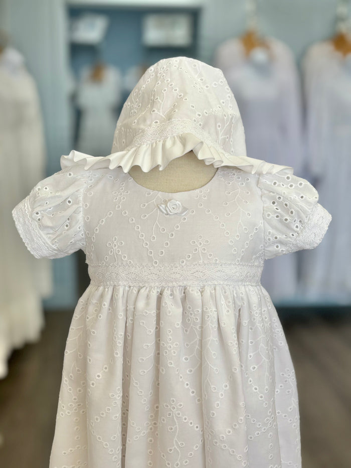 Long white baby gown with eyelet lace and matching bonnet.