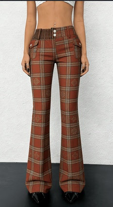 Brown plaid flared pants worn by a person on a white background