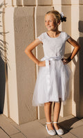 girl in white dress with tulle skirt