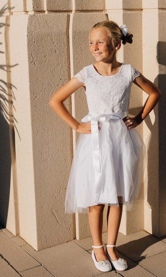 girl in white dress with tulle skirt