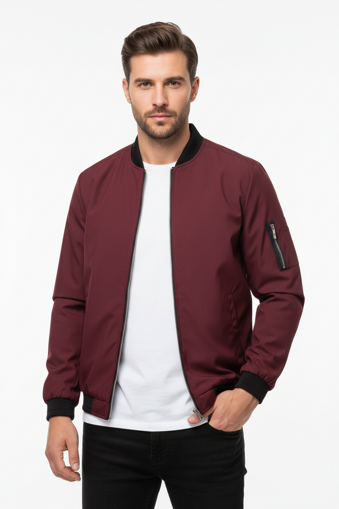 Men's slim casual baseball jacket styled with dark jeans and white sneakers urban setting