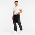 Men's black multi-pocket trousers styled on male model against a clean white background