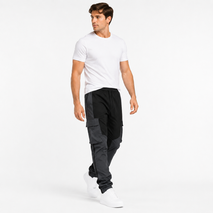 Men's loose fit cargo trousers in motion with natural drape and tapered black design