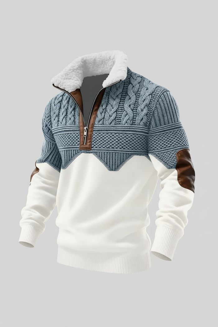 Flat lay of men's quarter zip sweater on wooden surface, dark tone