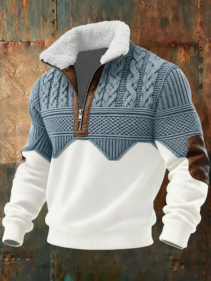 Sweater with white collar, blue patterned sleeves, and brown leather accents on a rustic metal background
