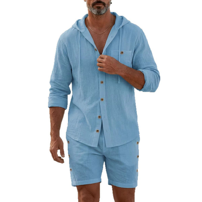 Man wearing a blue hooded shirt and shorts set on a white background