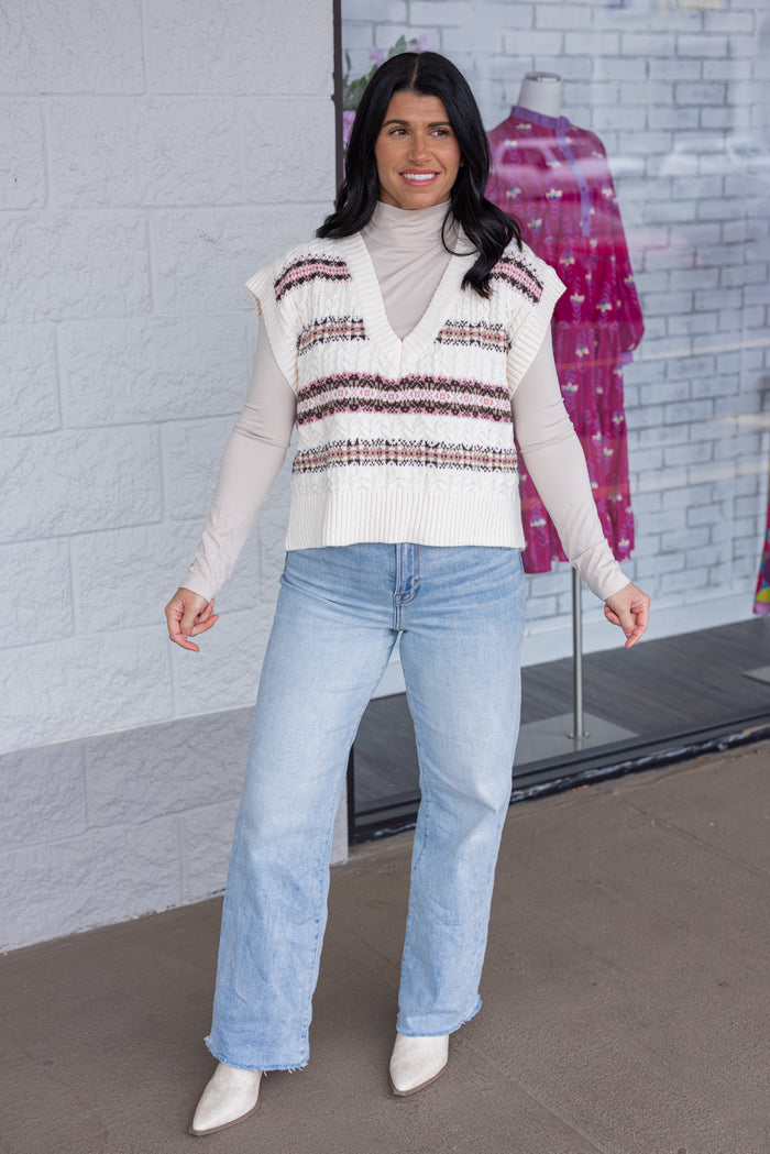 Women's ivory cable knit sweater vest style top with brown and pink stripes by idem ditto showing full front view