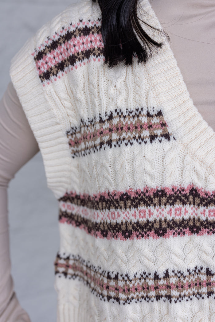Women's ivory sweater vest style top with brown and pink stripes by idem ditto showing cable knit texture