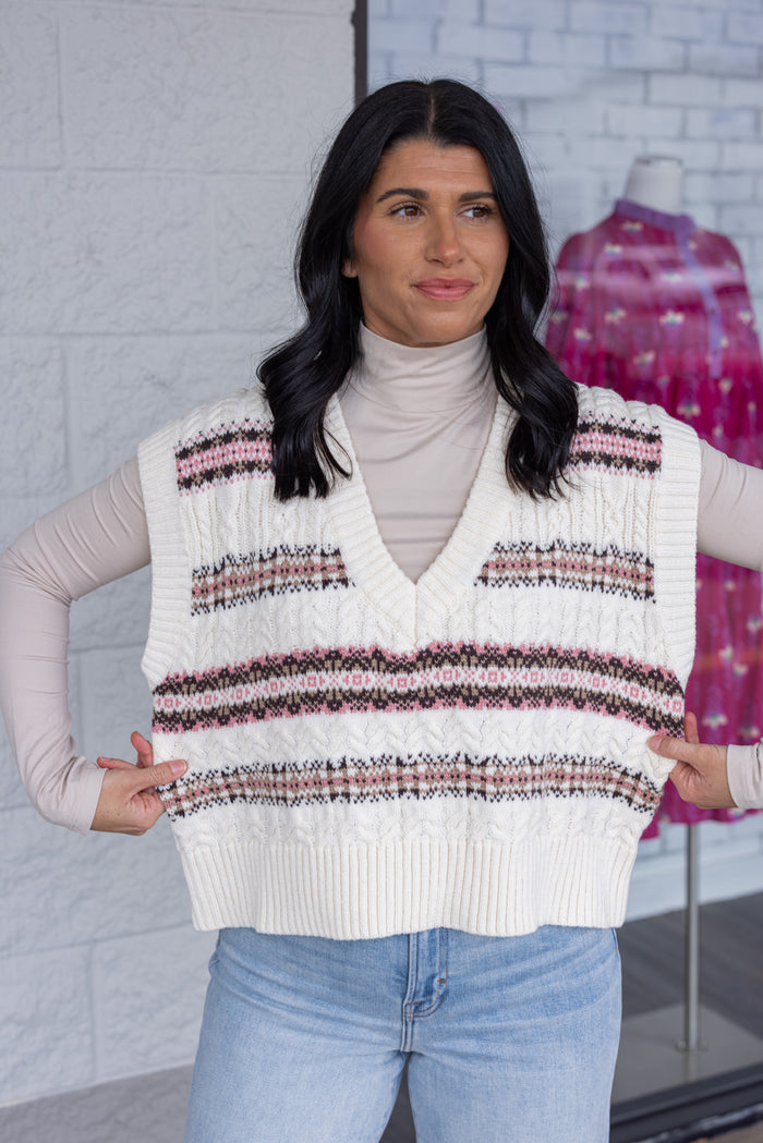 Women's ivory cable knit sweater vest style top with brown and pink stripes by idem ditto showing true to size fit