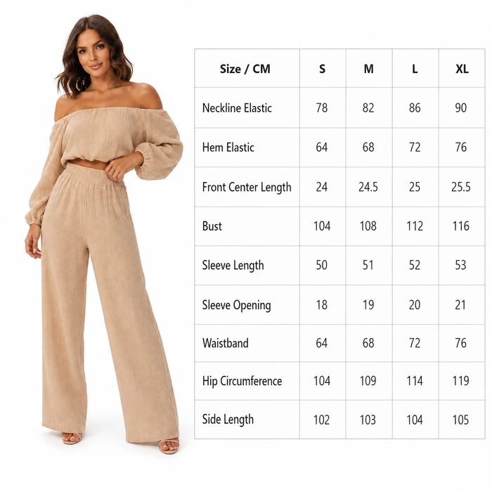 Woman wearing a beige off-shoulder top and wide-leg pants with a size chart on a white background.