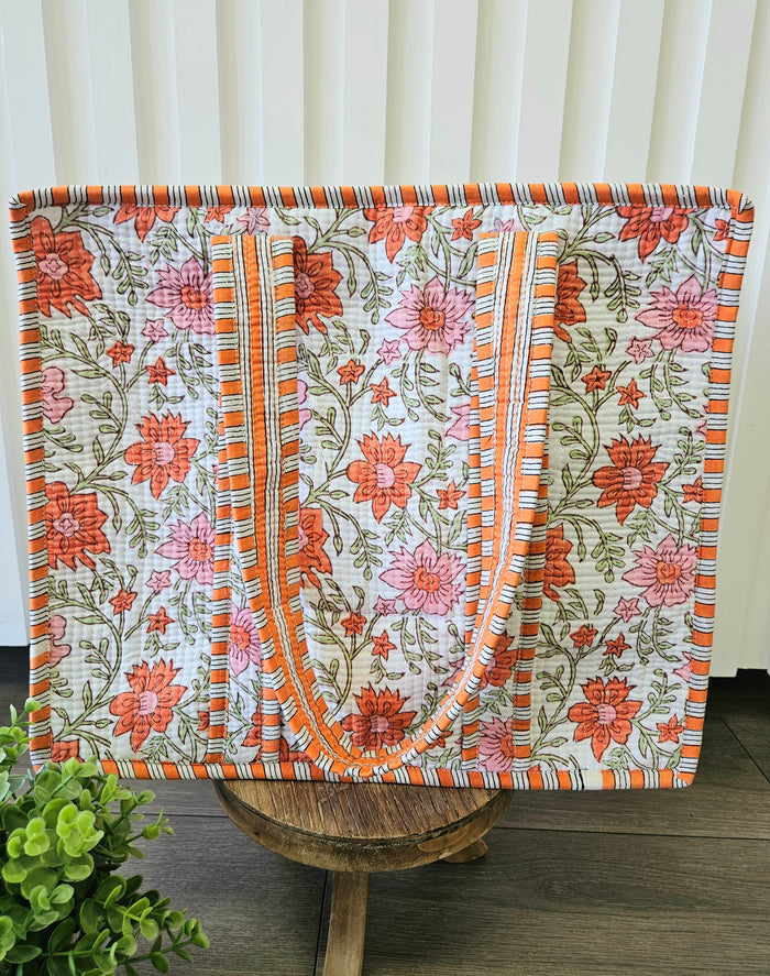 orange floral print quilted bag