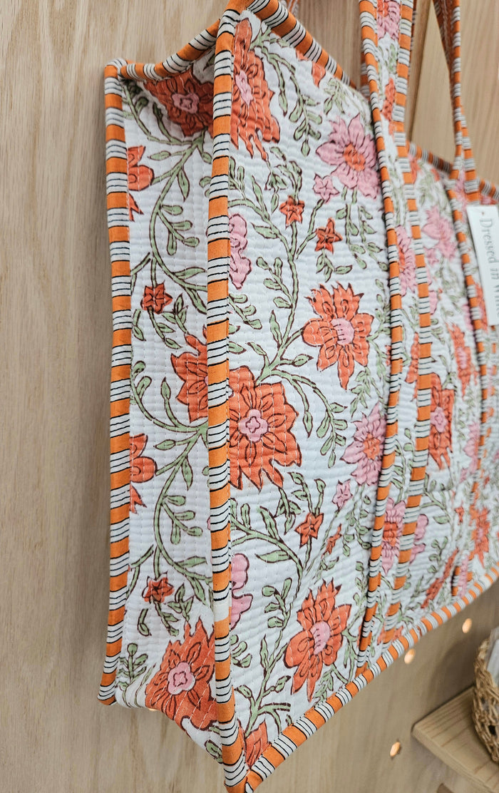 orange floral print quilted bag