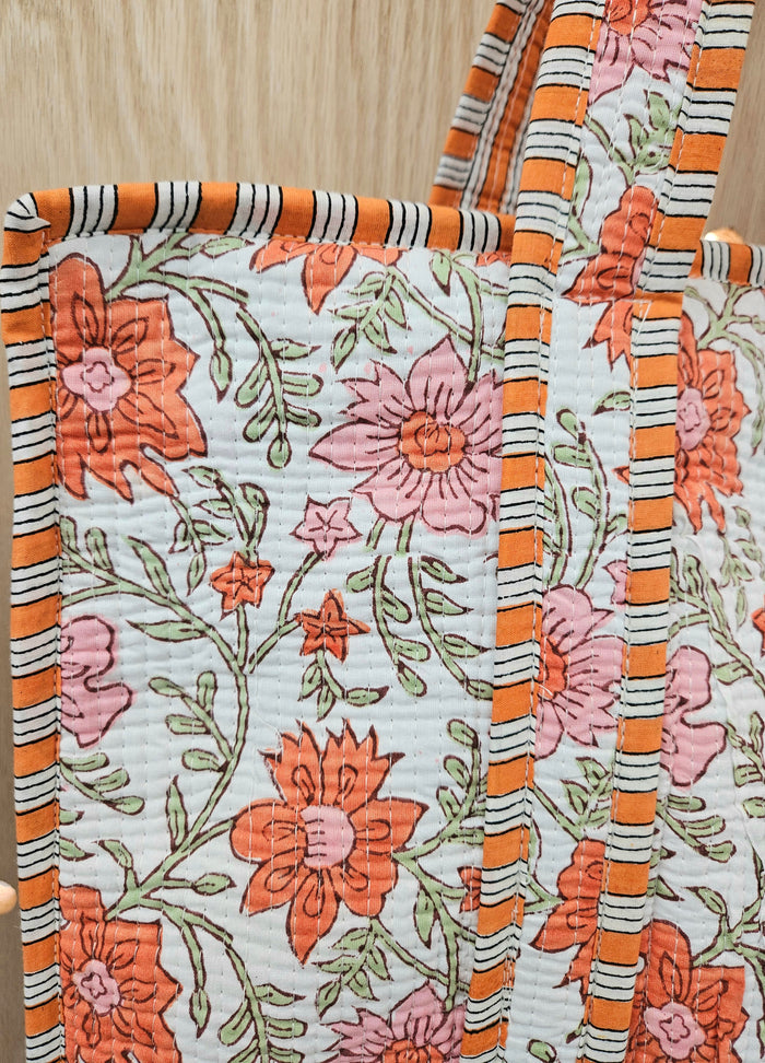 orange floral print quilted bag